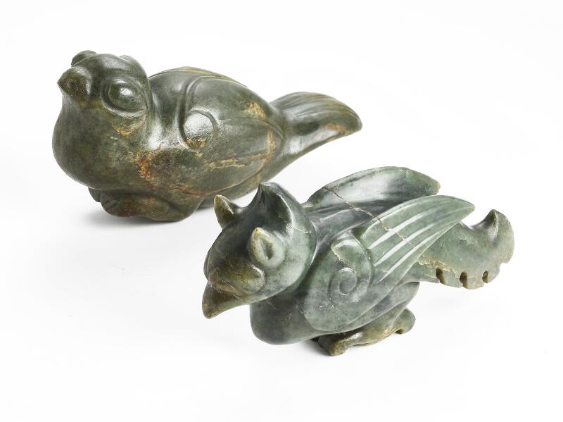 Two Chinese figurines of green jade carved in the shape of birds. Weight...
