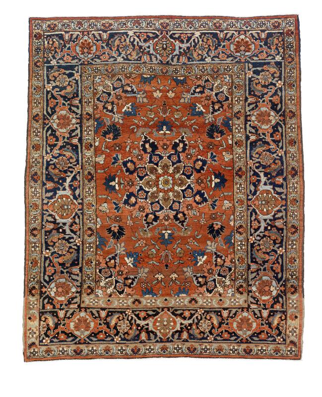 A small size Heriz rug, North West Persia. Medallion design on a red field...