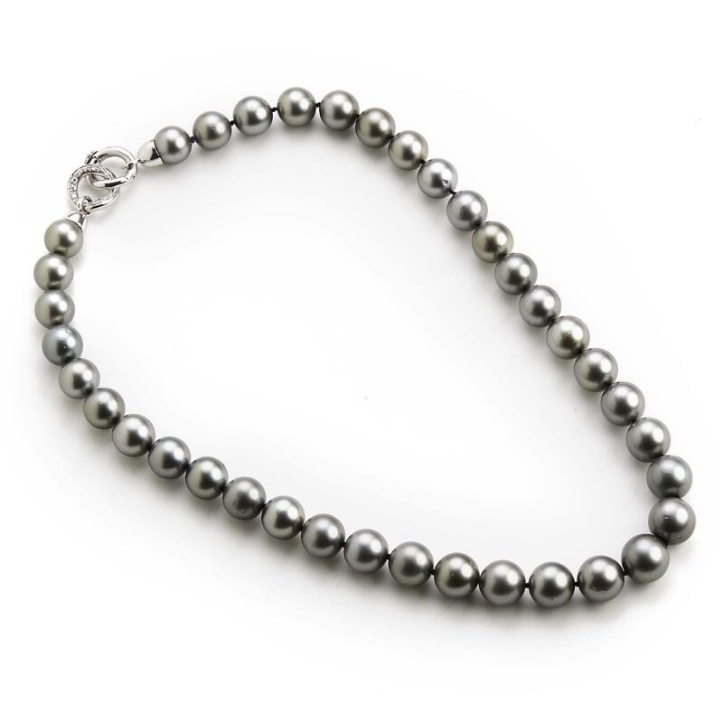 A Tahiti pearl and diamond necklace with cultured Tahiti pearls and a clasp...
