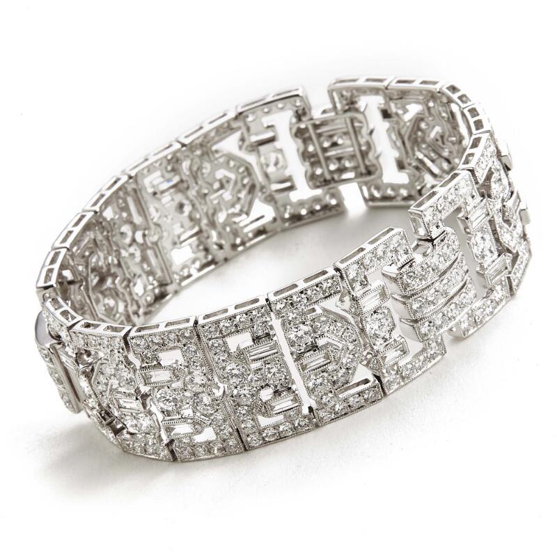 A diamond bracelet set with numerous diamonds weighing a total of app...
