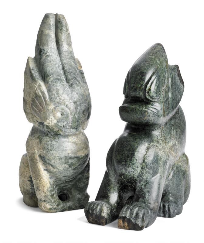 Two Chinese figurines of greenish jade in the shape of fabulous creatures...