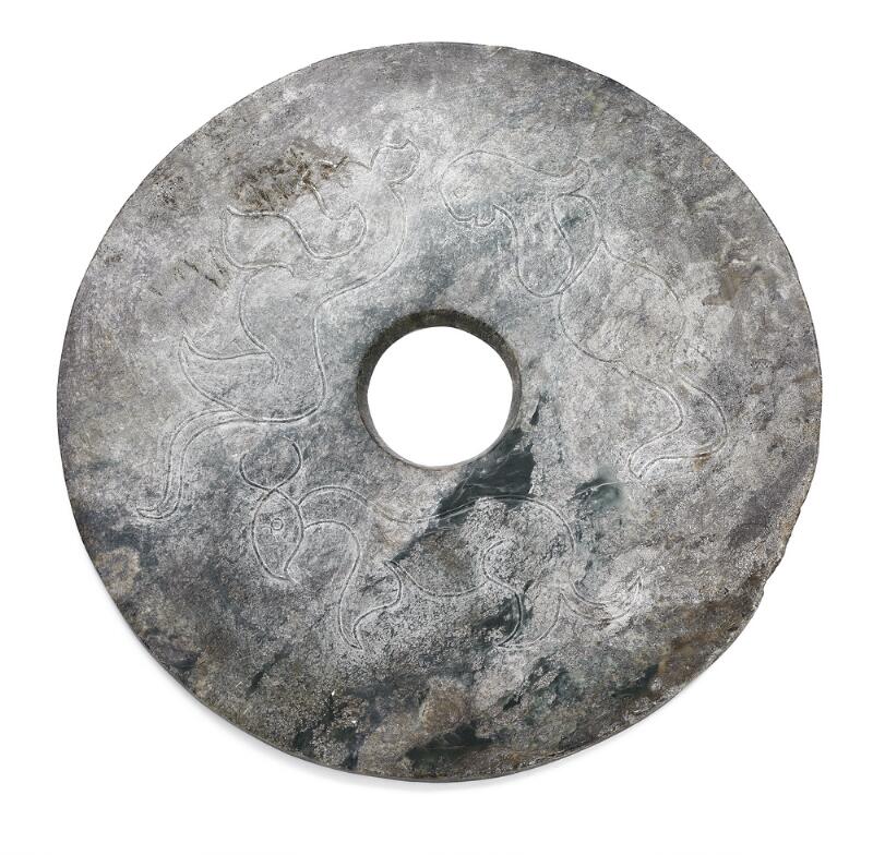 Chinese disc (bi) of green jade carved in low relief with Chilong dragon...