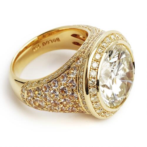 Bolou: A bombé diamond ring set with a brilliant-cut diamond weighing ...