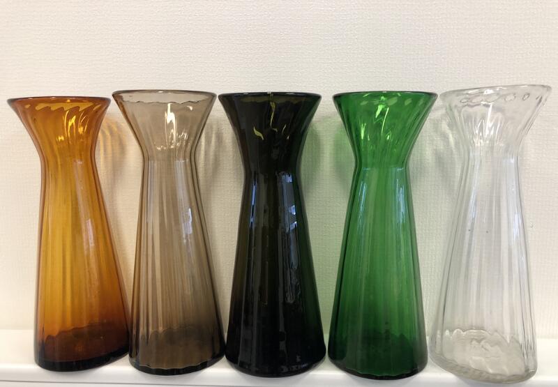 Five 20th century coloured and transparent glass hyacinth vases