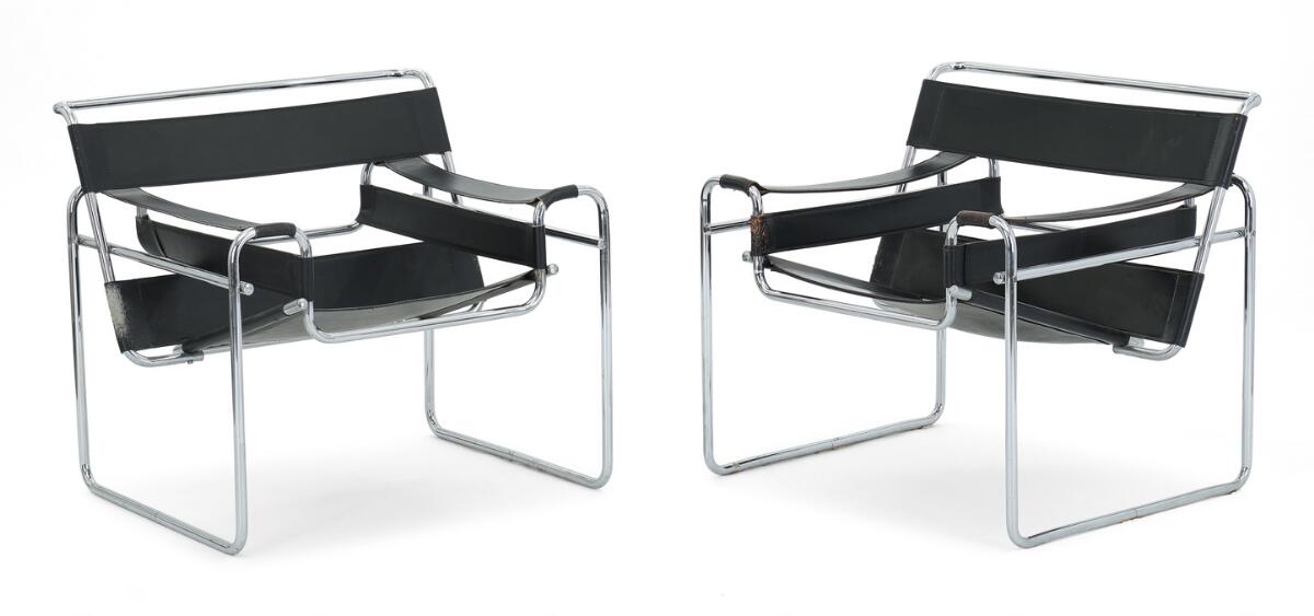 “Wassily Chair”. A pair of chromed tube steel easy chairs. Black grain leather seat back and armrests. Designed 1925. (2)
