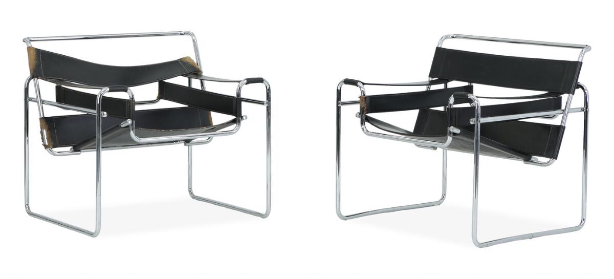 “Wassily Chair”. A pair of chromed tube steel easy chairs. Black grain leather seat back and armrests. Designed 1925. (2)
