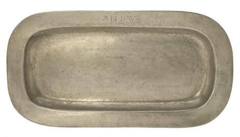 A large pewter dish of oval form. Engraved with owner initials. L. 74 cm. W. 38 cm.