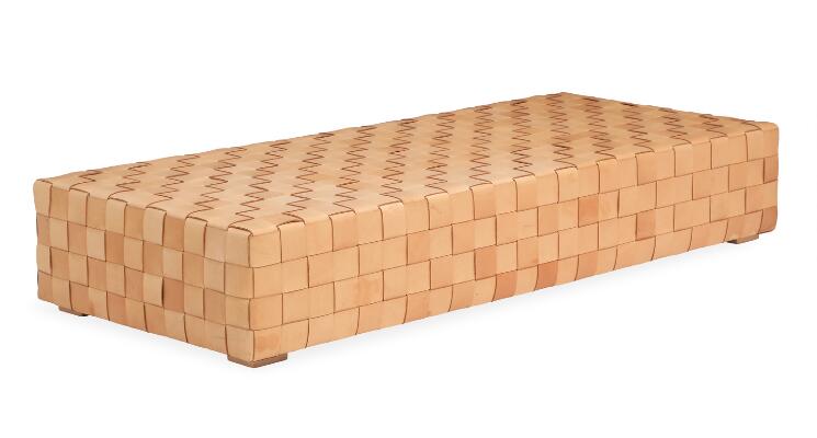 Daybed covered with woven girths of patinated natural leather. This example made approx. 2010 by upholsterer Ivan Schlechter, with maker's stamp. H. 34 cm. L. 191 cm. W. 87 cm.
