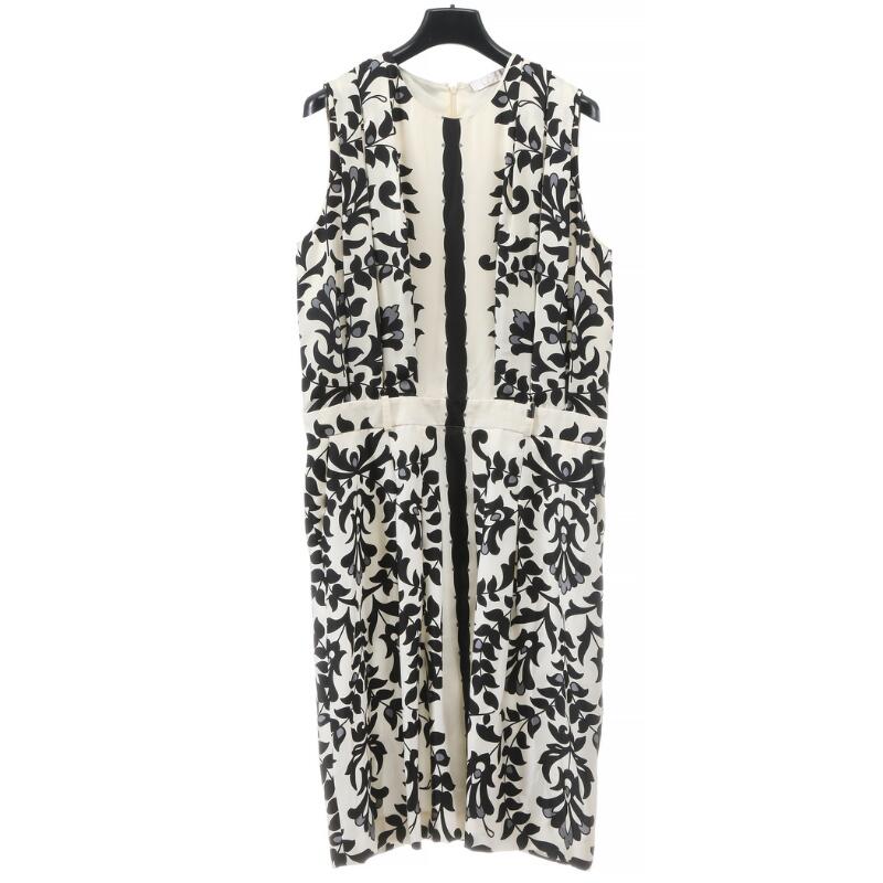 Chloé: A dress of white silke with black flower print and a zip in the...