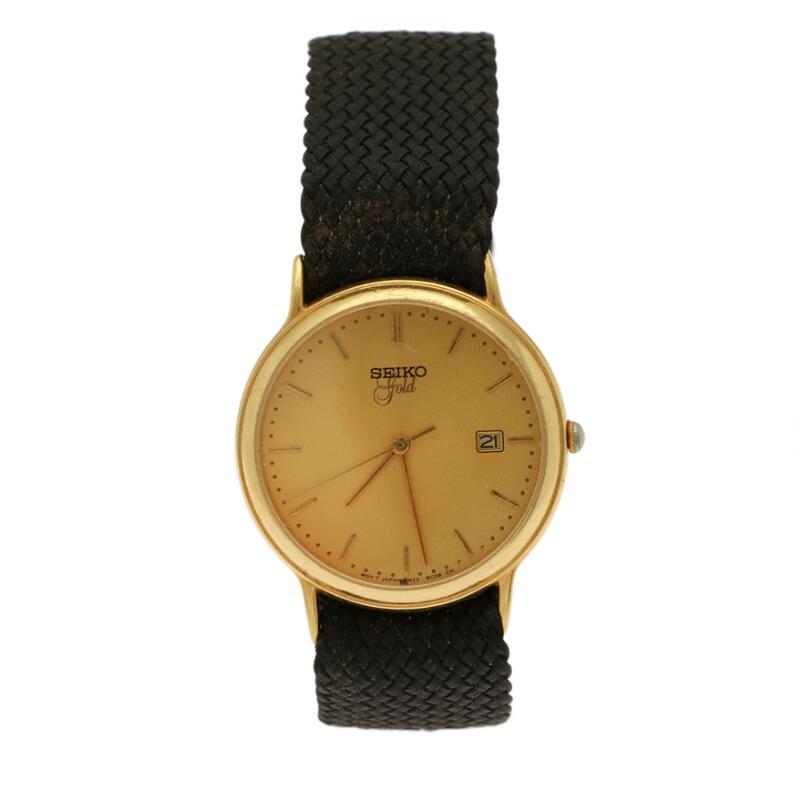 Seiko: A gentleman's wristwatch of 18k gold, ref. 7N22-S003. Quartz  movement with date. 1990s. - auctions & price archive