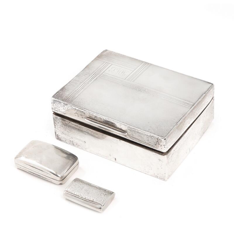 An English sterling silver case and two pill boxes. 19th-20th century. Case...