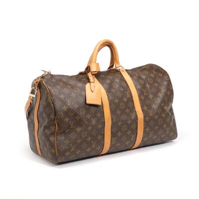 Louis Vuitton: A Keepall 50 travel bag of brown monogram canvas with  brown leather trimmings and gold tone hardware. – Bruun Rasmussen  Auctioneers