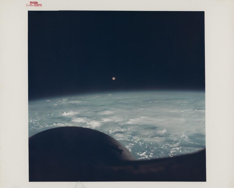 [Gemini VII] First photograph taken by humans of the Moon rising over the...