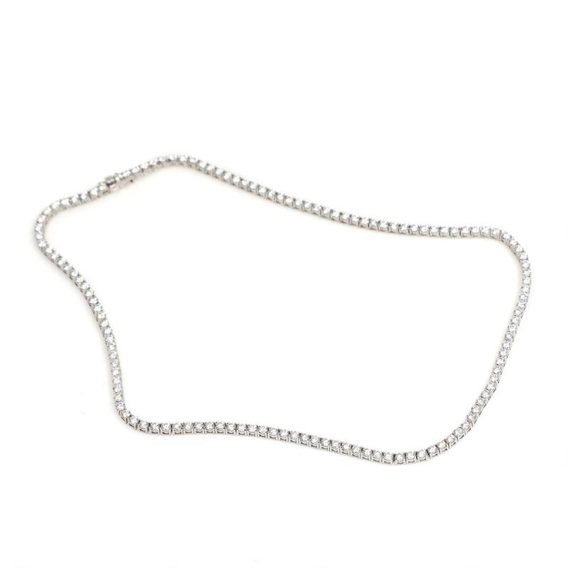 A diamond necklace set with brilliant-cut diamonds weighing