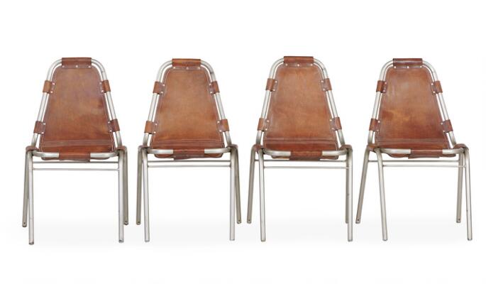 “Les Arcs”. A set of four chairs with chromed steel tube frame. Seat and back stretched with patinated cognac-coloured leather, fitted with metal nails. (4)