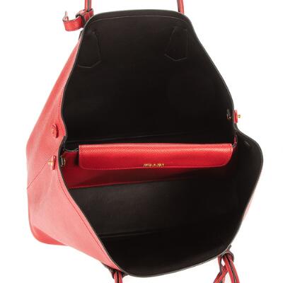 Prada: A bag of red Saffiano leather with gold tone hardware, two