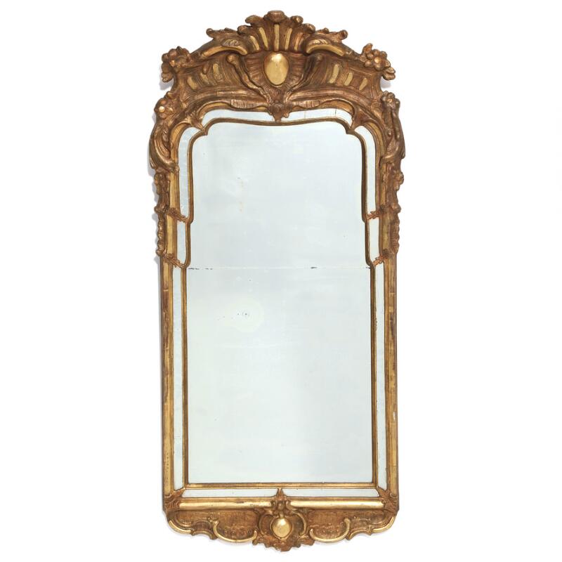 A large Swedish rococo mirror in carved frame later bronced. Mid