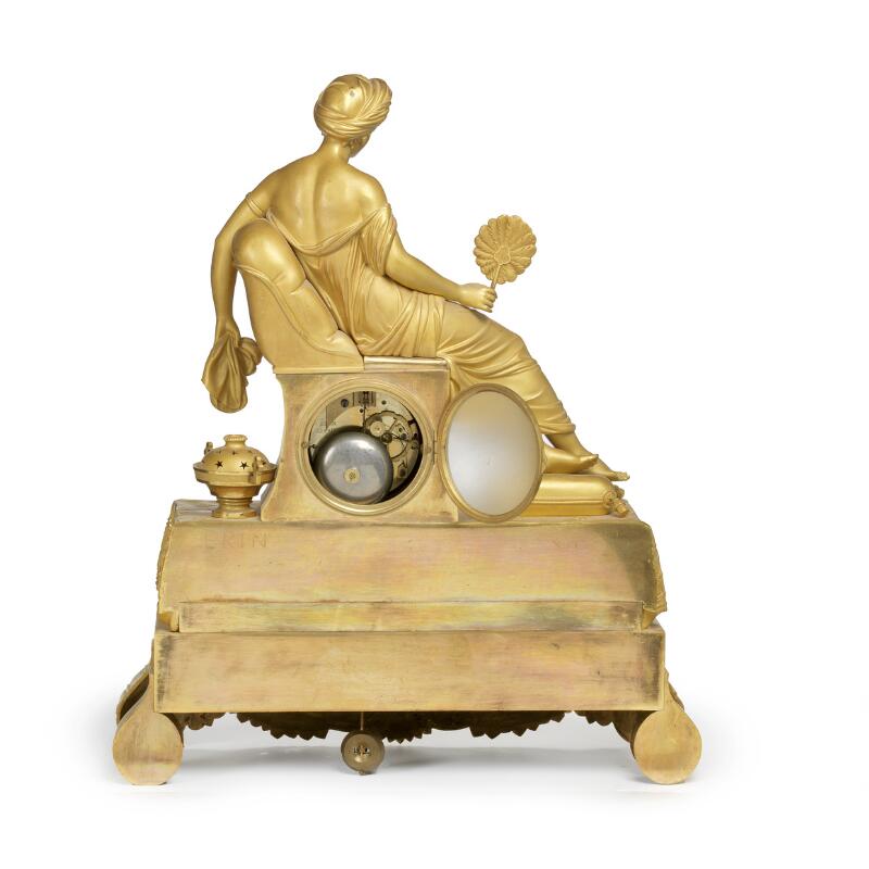 A Charles X figural table clock. The dial is signed 'Nicoll a