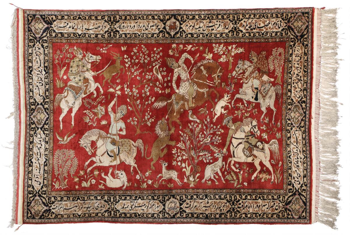 A full silk Qum rug, Persia. Classical hunting scenery surrounded by border with Persian poems. Late 20th century 109×150 cm. — Carpets & Rugs — Bruun Rasmussen