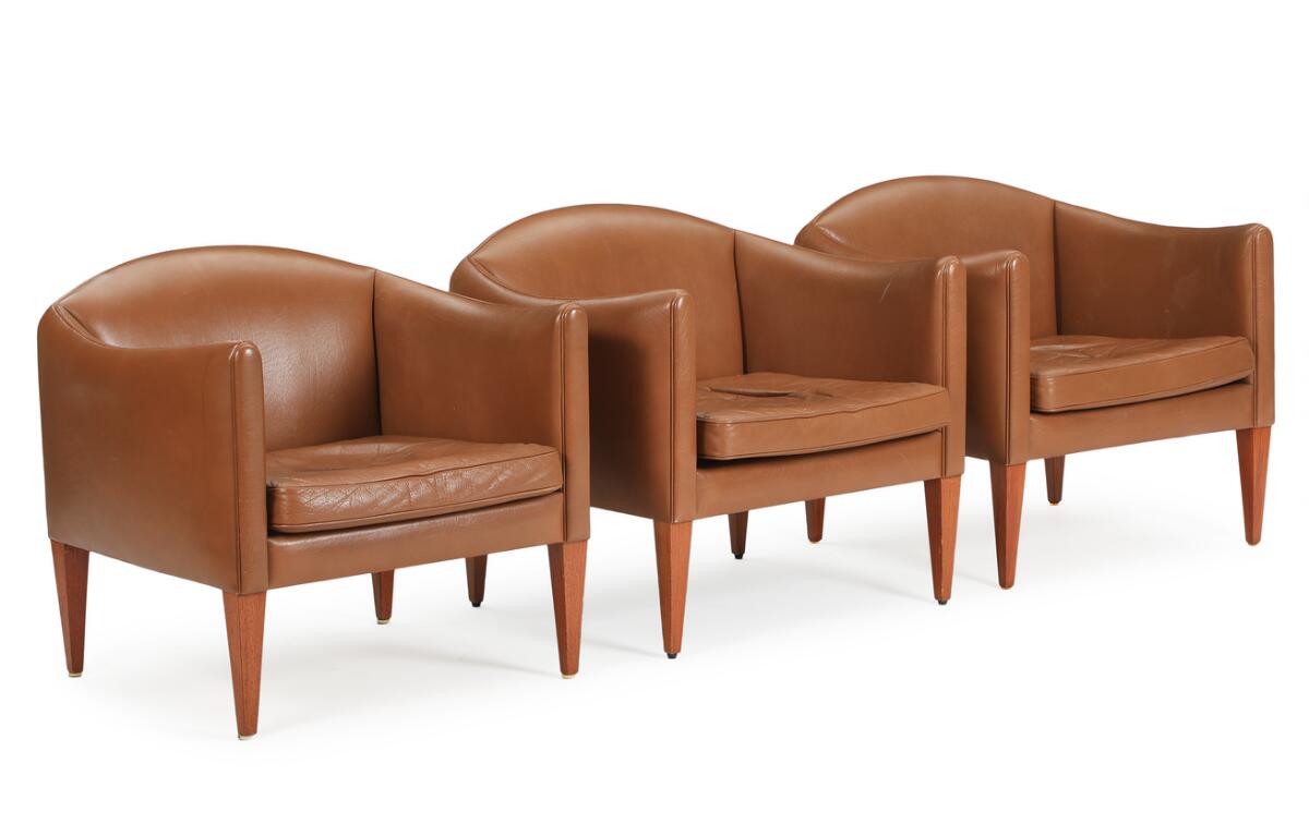 Illum Wikkelsø: Three easy chairs upholstered with brown leather