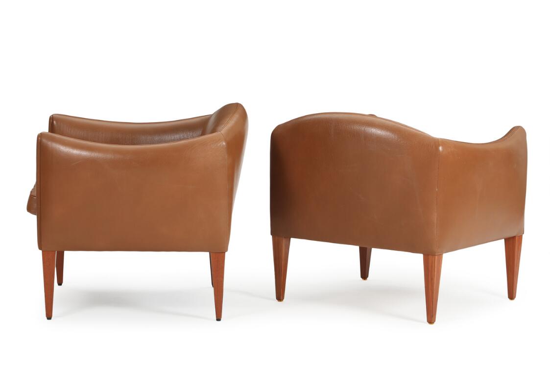 Illum Wikkelsø: Three easy chairs upholstered with brown leather