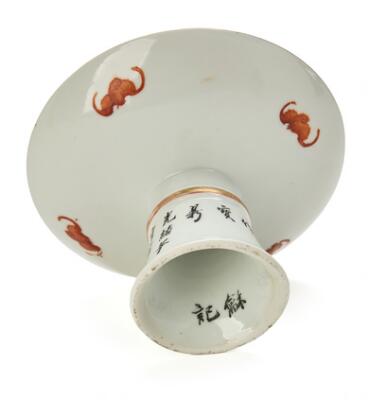 A Chinese porcelain stemdish painted in iron-red, black and gold