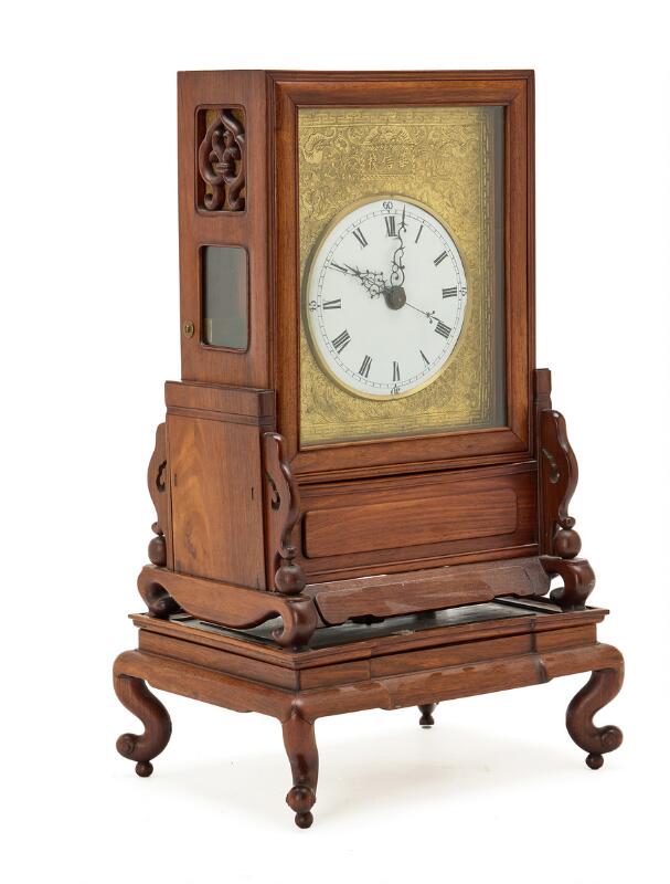 A Chinese hongmu mantel clock, white enamel dial and brass plaque