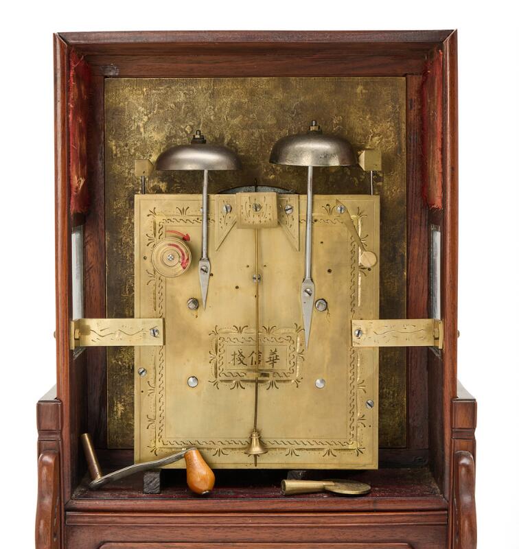 A Chinese hongmu mantel clock, white enamel dial and brass plaque