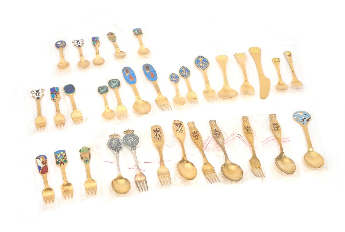 A collection of sterling silver anniversary and christmas cutlery