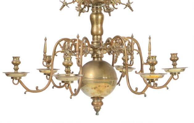 A Baroque style brass church chandelier with six light arms and 12
