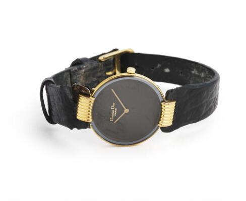 Christian Dior: Gilt steel, ref. 46-153. Quartz movement. 2000s