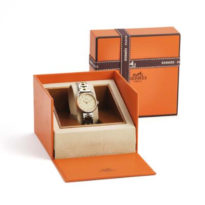 Hermès: Arceau of 18k gold and steel, ref. 666563 A. Quartz