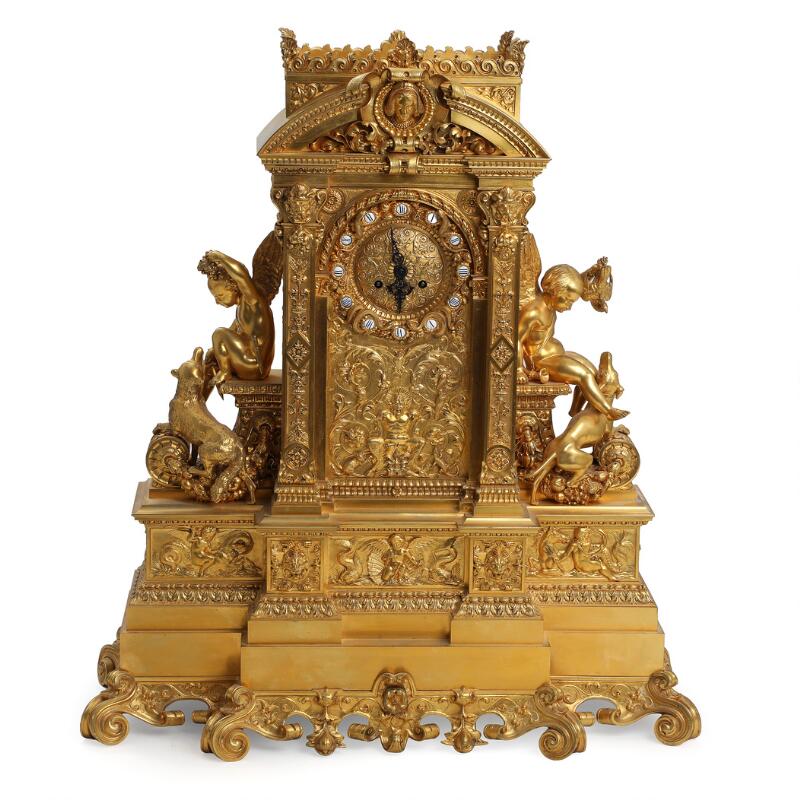 Large French console clock of gilded bronze, richly decorated with