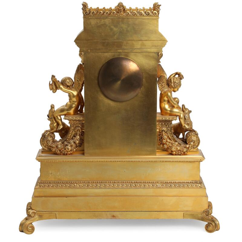 Large French console clock of gilded bronze, richly decorated with