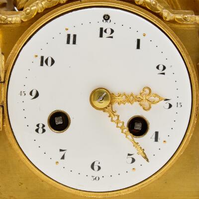 A French mantel clock. Louis XVI style, first half of the 20th