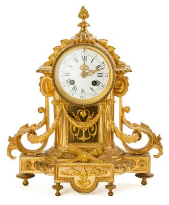 A French Louis XVI mantel clock of gilded bronze, white enamel