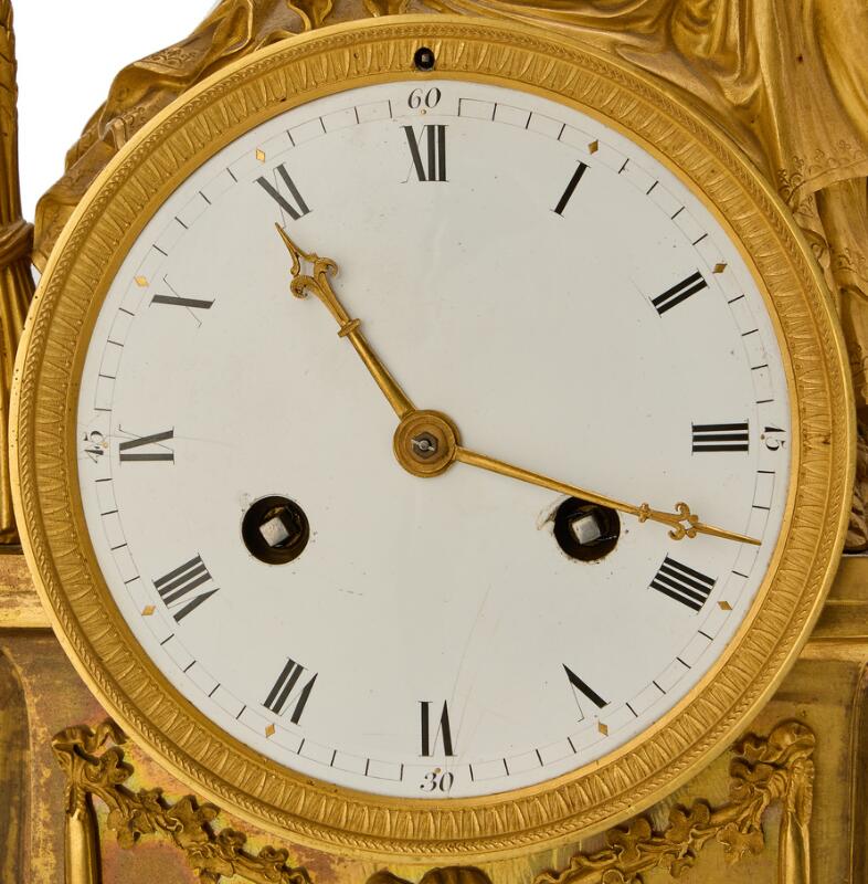 A French Empire mantel clock. Early 19th century. H. 49 cm. W. 38
