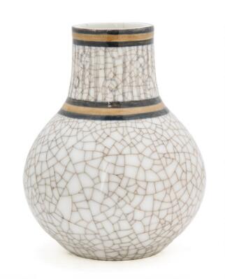 A porcelain vase decorated in crackled glaze with two horizontal bands in brown and black, signed F. Garde. 1968/27. Bing & Grøndahl. H. 13.5 cm.