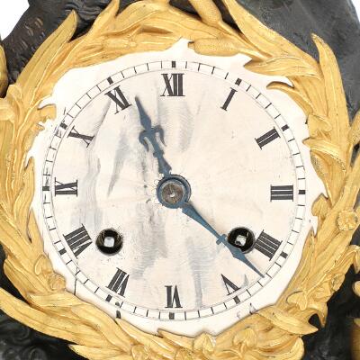 French mantel clock of gilded and patinated bronze, decorated with