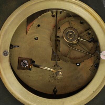 French mantel clock of gilded and patinated bronze, decorated with