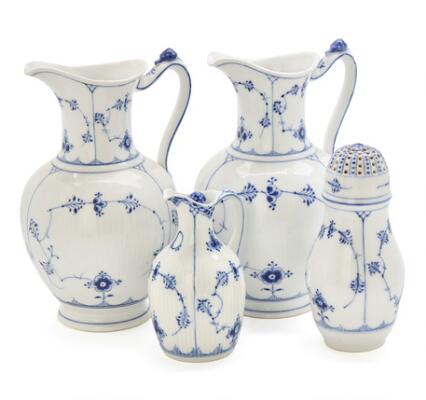 Blue Fluted two hot chocolate jugs and a caster, further, a Full
