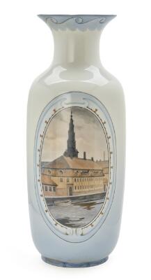 A large porcelain vase painted with Christian's Church and Søkvæsthuset in Christianshavn/Copenhagen. Signed Elias Petersen. Bing & Grøndahl. H. 59 cm.