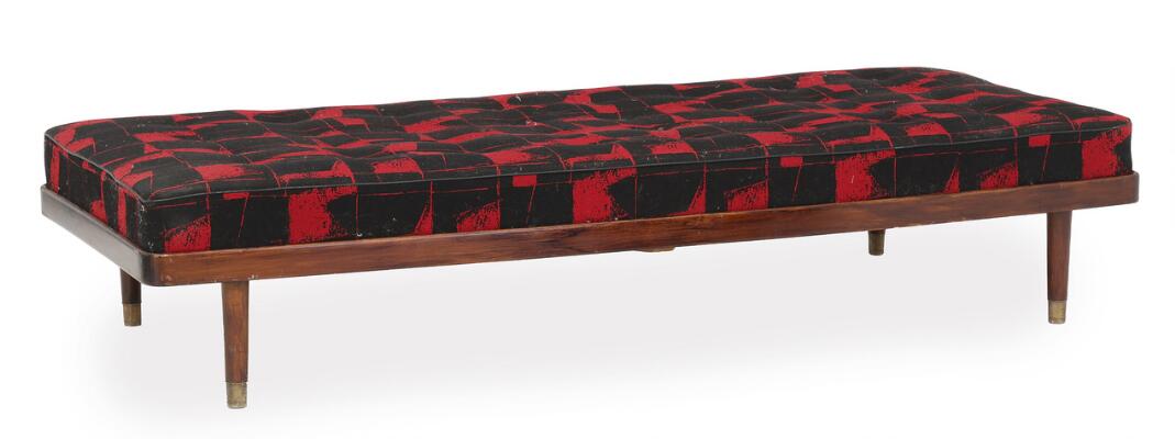 Daybed with rosewood frame. Brass shoes. Loose mattress upholstered with red/black patterned fabric. H. 48 cm. L. 186 cm D. 79 cm.