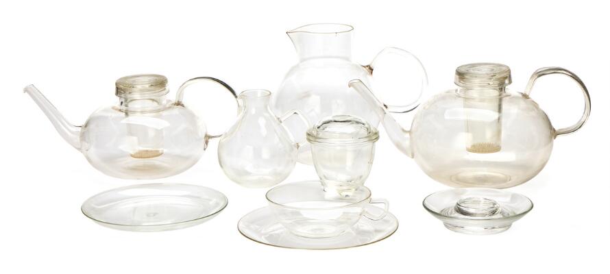 Bauhaus glass tea service. Designed primarily in the 1930s. Produced by and marked Jenaer Glas, partly marked Schott & Gen. and Saale Glas. East and West Germany. Also six unmarked pressed-glass egg cups. (76)