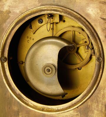 A French late Empire mantelpiece clock, gilded bronze with the