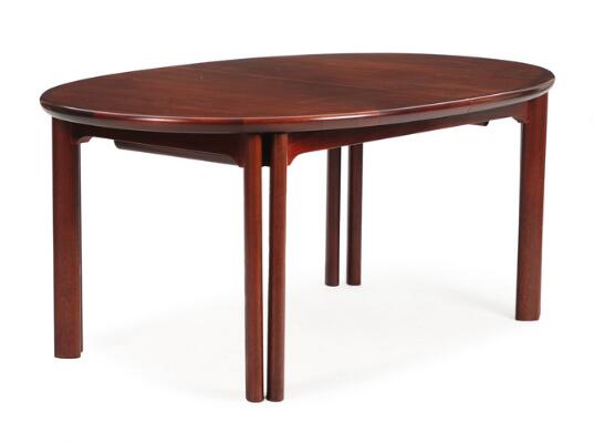 An oval rosewood dining table with extension, double frame and three extra leaves. Manufactured and marked by Skovby Møbelfabrik. 1980s. H. 73. L. 174/324. W. 109 cm. (4)