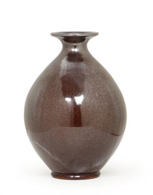 Vase in earthenware decorated with reddish-brown lustrous glaze. Signed HAK, Danmark. Manufactured by Kähler. H. 29 cm.