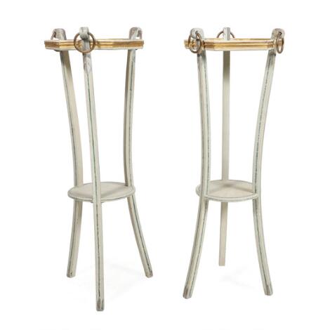 A pair of pedestals in white painted wood with staffwork in green and gold. 20th century. H. 98. Top Diam. 35 cm. (2)
