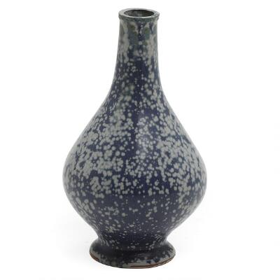 Stoneware vase, pear-shaped with a small mouth. Decorated with blue-speckled glaze with green elements. Unsigned. H. 16 cm.