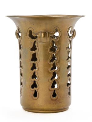 Wine bottle holder in patinated bronze with pierced pattern. Manufactured and stamped on the bottom by Tvermoes & Abrahamson. H. 20 cm.